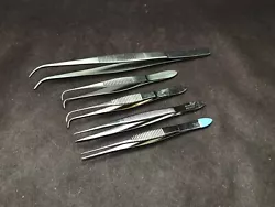 Good used condition. Lot of 5 includes: one VWR 6” x 1.2mm curved tip tweezer, two Roboz 4” straight 0.3mm serrated...