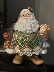 This Fitz and Floyd St. Nick Ceramic Santa Cookie Jar is the perfect addition to your holiday decor. With a round shape...