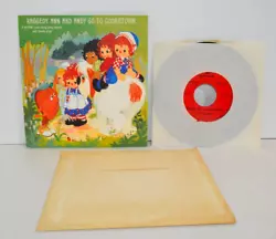 Contains original envelope, pop-up book/card and record in sleeve.