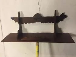 Mahogany scrolled and carved antique shelf from early 1900s. Requires 2 screws in Wall to hang. Expected condition for...