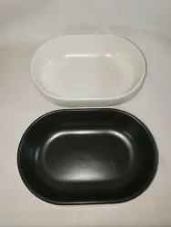 For sale is a set of like new Emile Henry oval baking dishes/individual dishes in two colors, dark grey and white....
