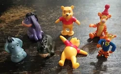 Add some whimsy to your Disney collection with this lot of 7 PVC figures featuring Winnie the Pooh, Tigger, and Eeyore....