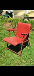 Introducing a charming antique red metal folding chair designed by Russel Wright Sansom. This mid-century modern chair...