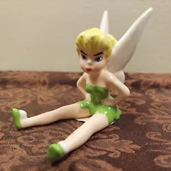 This is a vintage Disney Tinkerbell figurine from the 1990s. It features Tinkerbell sitting and pouting with a height...