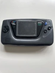 CONSOLE GAME GEAR SEGA (à réparer). La console s’allume mais l’écran bug quand on augmente la luminosité elle...