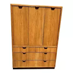Cabinet has 1 door and 1 bi-fold door with adjustable shelf interior and 3 lower drawers. Style Edward Wormley. Pickup...
