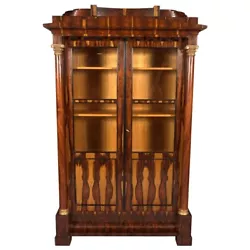 Exotic Indian rosewood on solid conifers. A versatile, curved frame box on pedestal feet. Architecturally structured...