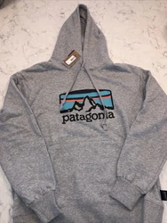 Patagonia Mens Sweater Medium Gray Uprisal Hoody Pullover Sweatshirt Size m. Slight mark on logo. See pic.