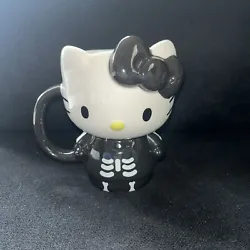 This Hello Kitty Halloween Skeleton Mug is a rare and highly sought-after item for any collector or fan of the iconic...