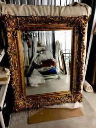 Classical large frame gold guilded mirror. Beveled mirror is 30inches X 40inches. Total Framed dimensions are Approx...