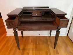 Antique solid mahogany spinet style writing desk with closing lid to hide away for privacy between use. Made by...