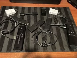 Fire stick lock, comes with two remotes, three actual fire sticks. Three chargers, three charging cords, and one...