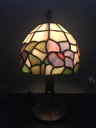 Illuminate your space with this beautiful floral stained glass lamp. The lamp is designed in a stunning Victorian style...