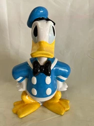 Disney Donald Duck Sitting on Film Reel Canisters Cookie Jar. Good condition.  See photos for details.  Was displayed...