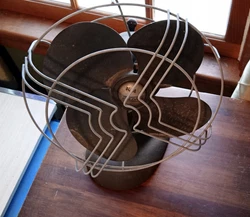 Knapp Monarch. There is no power cord, so it is untested. It is also missing one nut to hold the cage in place. So its...