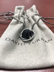 David Yurman Infinity Pendant Necklace With Onyx in 14mm With 18 Chain. Mint condition.Come with original pouch.