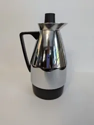 This is a stylish MCM carafe with sleek design. It is stainless steal in design.