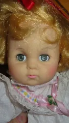 This doll is in overall nice condition. Has a very pretty face. Cloth and vinyl body. Not sure if she is suppose to cry...