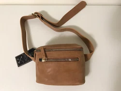 Cognac color. Also has a small zippered pocket outside.
