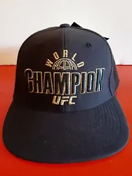 VERY NICE   UFC WORLD CHAMPION BLACK AND GOLD REEBOK HAT CAP - NEW W/ TAGS - ADJUSTABLE.  Buyer to pay usps priority...