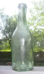 Old aqua glass bottle. 19th century construction. All seamless with hand tooled lip rim. Embossed 3 to base. Internal...