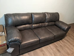 Black Leather Sofa by Ashley Furniture.