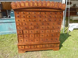 Circa 1870 custom made CARRIAGE BOLT cabinet. Made with cherry - & crown with CARRIAGE BOLTS has maple inlay. 50.5