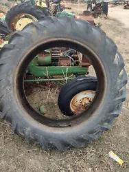 15.5-38 Rear Tractor Tire. About 80 percent tread. No large holes. Has a couple of weathered spots where it sat flat at...