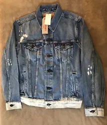 Trucker Jean Jacket featuring. Jacket done in Blue with gold stitching and random Bleach Areas and spots.