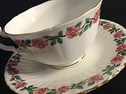 VERY PRETTY DORCHESTER CUP AND SAUCER. PINK FLOWERS WITH GREEN LEAVES AND GOLD TRIM. FINEST BONE CHINA. ENGLAND.CUP IS...