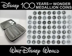 The photos are of the coins in front of a 100th background. Walt Disney World property.