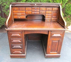 This is a survivor of a roll top desk complete in all respects including the interior.  It measures 50