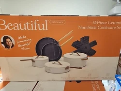 Beautiful 12pc Ceramic Non-Stick Cookware Set, White Icing by Drew Barrymore. Condition is New. Shipped with USPS...