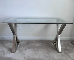 Glass top desk with silver base in great condition bought from Pottery Barn. The dimensions are 52L,28W,30H.  