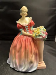 This vintage Royal Doulton figurine portrays a lovely lady named Roseanna holding a bouquet of roses. Made of fine bone...
