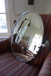 Here is a stunning Pottery Barn pivoting bathroom mirror with a beveled edge and a textured knob on each side for the...