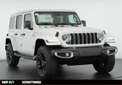 This ALL NEW 2024 Jeep Wrangler Sahara 4xe features the bright white clear coat exterior and black mckinley trimmed...