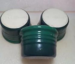 You are looking at 3 Le Creuset deep green ramekins  in EUC. The color at the bottom is a darker green than the rest...