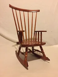 Miniature Windsor Spindle Back Cherry Wood Rocking Chair.