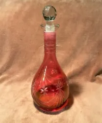 This elegant decanter is a very beautiful piece of cut glass in a very pretty cranberry color & is a great edition to...
