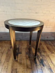 1990’s Donghia Round End Table With Checkerboard Insert. Brass SabotsSignedSigns of wear consistent with age and...