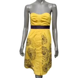 Sleeve Style - Strapless. Color(s) - Yellow with purple. Pattern - Embroidered flowers. Closure - Side zipper....