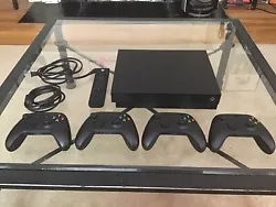Up for sale is a Microsoft Xbox One X 1TB Home Console - Black. It comes with one media remote and four Carbon Black...
