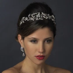 This beautiful antique silver headpiece encrusted with clear cut rhinestones adds a magical touch to this bridal...