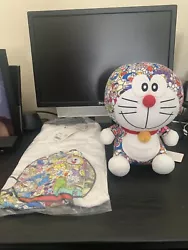 UNIQLO Doraemon x Takashi Murakami Collaboration Plush & White Tee. T-Shirt is white medium still sealed in the...