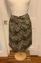 Wrap/foldover detail at front waist, back zip with kick pleat on bottom. This skirt is in a size 18w. Length is 21