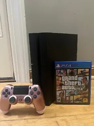 Playstation 4 Console 500 GB (Used) with Grand Theft Auto V and Rose Gold Controller. The Playstation is in good...
