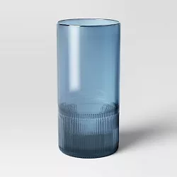 •Large size tinted glass vase in blue color •Ribbed-textured finish •Watertight construction •Hand wash ...