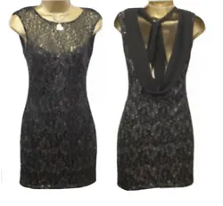 Scoop neck front with beautiful cowl back detail and ties at the back. Slim fitted dress. Slim fitted. Gorgeous dress...