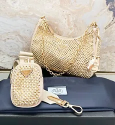 In Stores Now!! Gorgeous authentic Prada Satin Crystal Embellished Re-Edition 2005 Shoulder Bag in gold. This Prada...